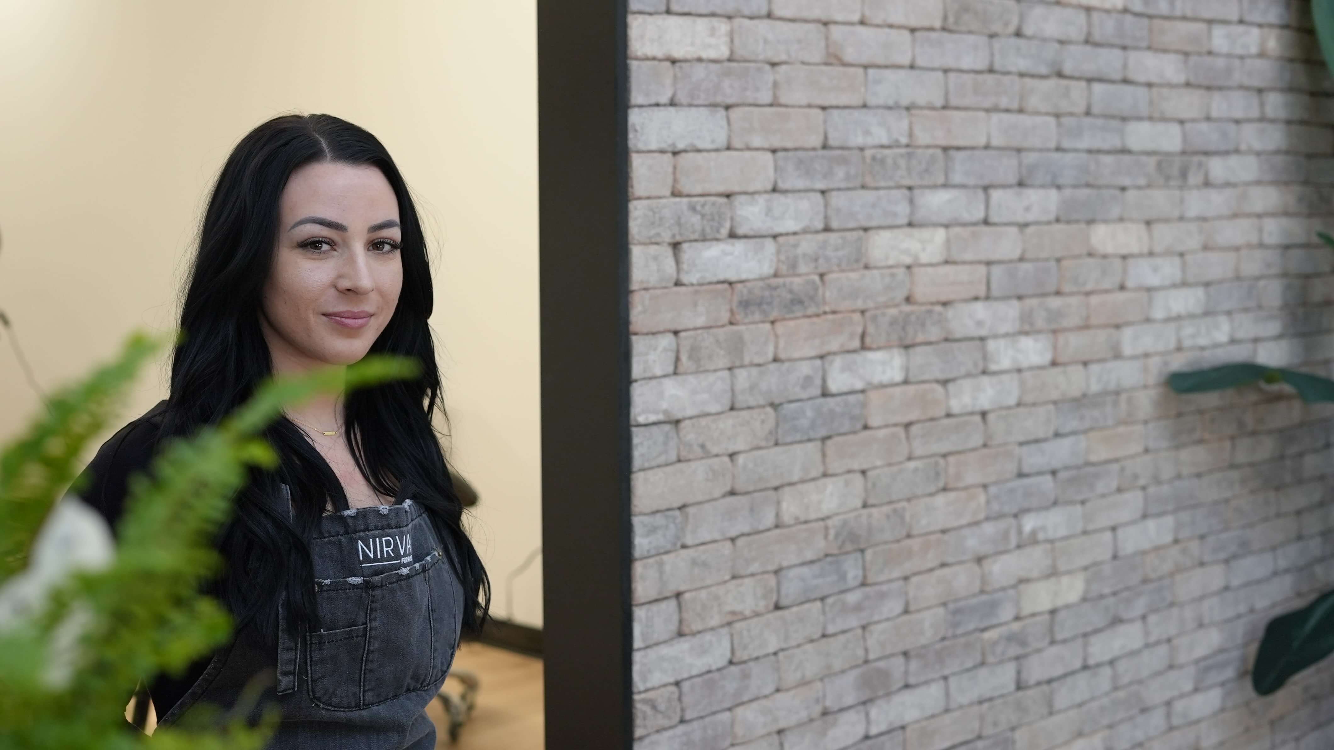 Sarah Delaney professional headshot with Nirvana apron